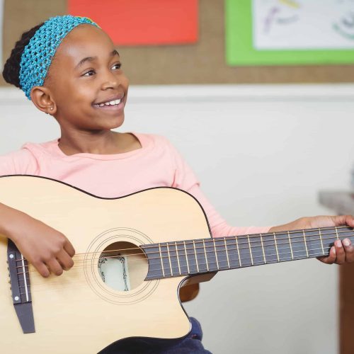 girl playing guitar